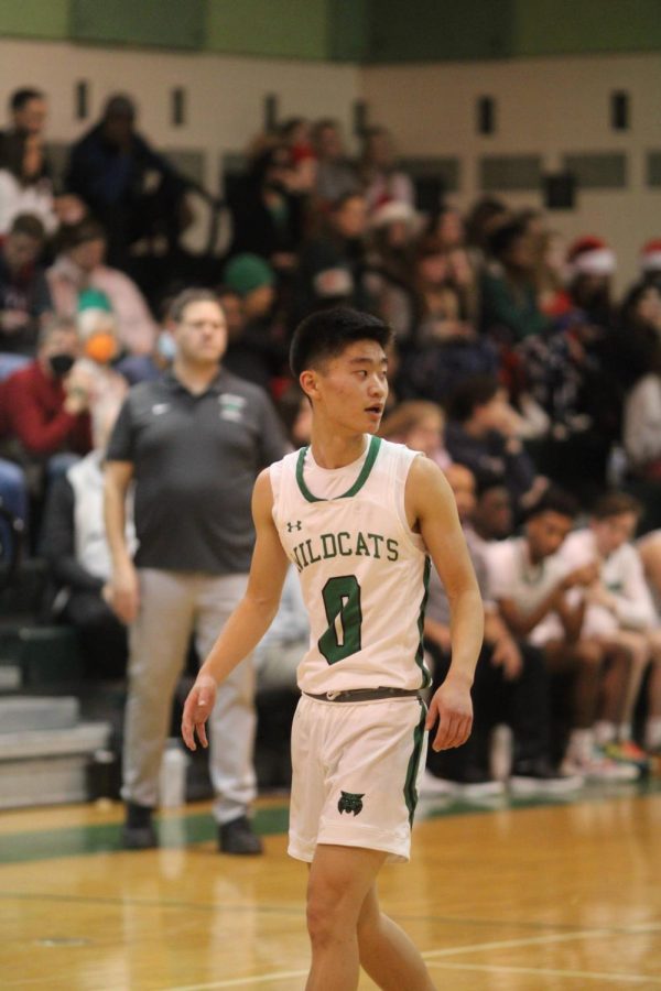 Junior Ben Kim looks for an open opportunity on the court. Kim was the leading scorer with a game-high 18 points this season.