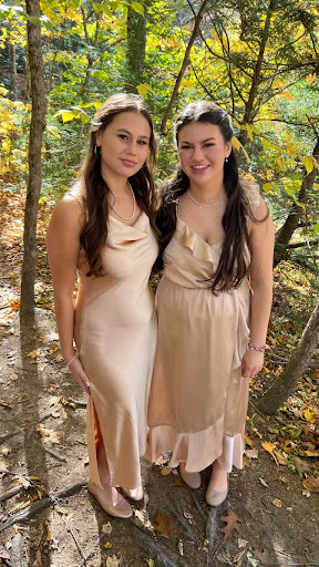 Bridesmaids and sisters Ella and Isa Schaefer-Fortier match in silk dresses. They were going to their aunt’s wedding in Maine. “Having a sister that is close to me in age is really nice because we relate to one another, can help each other when we need it, and can accompany each other at awkward family functions,” sophomore Ella Schaefer-Fortier said.
