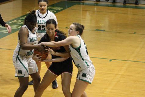 Sophomore forward and junior captain and guard Maggie Cullen-Ising try to force a turnover against the Northwood Gladiators. The Wildcats demolished the Gladiators 80-3 to improve to 2-1.