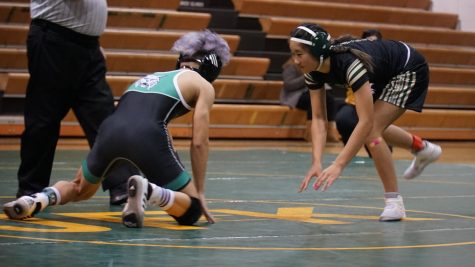 Senior Alex Alfelor wrestles against Kennedy High School. He is one of the leaders on the team and a very important wrestler.