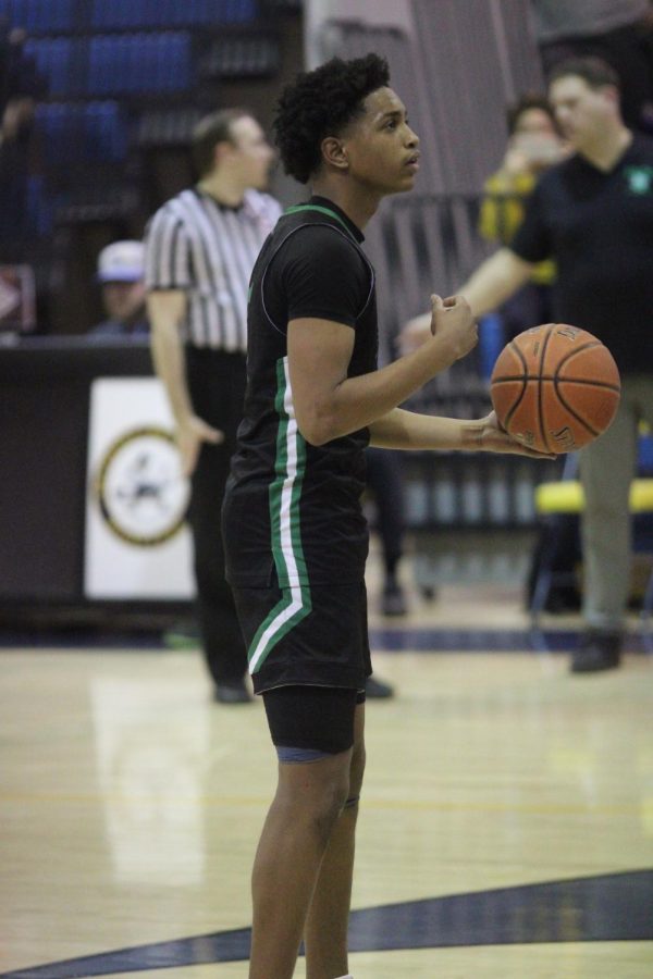 Senior Christion Wright shoots two at the line. Wright went on to make 4 back-to-back three-pointers in the third quarter.