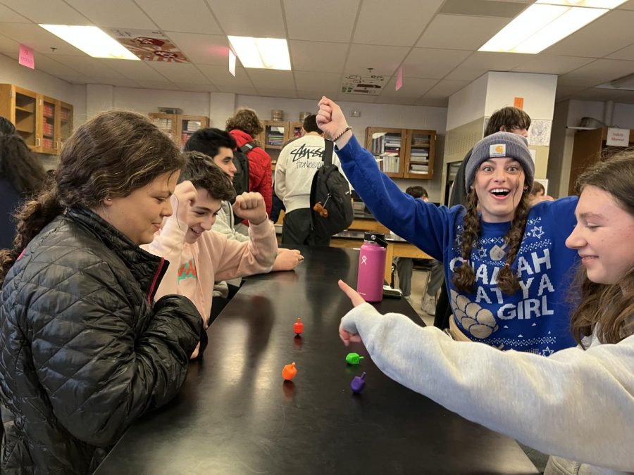 Several+students+joined+together+to+play+in+the+most+popular+game+of+Hanukkah%3A+Dreidel.+%E2%80%9CIt+was+super+exciting+to+see+everyone+participate+in+our+traditions.+Hanukkah+has+such+a+good+spirit%2C+it+was+really+fun%2C%E2%80%9D+senior+and+president+Maia+Byala+said.