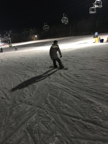 Dylan Weintraub snowboards down the bunny slope in liberty. She loves the winter ski season and the snow.