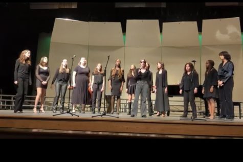 Senior co-leader Norah Mannle solos as Vanilla performs Rolling in the Deep by Adele at the winter choral concert. The group is looking to do more upbeat music for the spring.