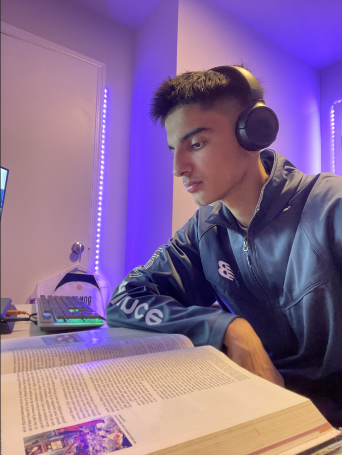 Junior Waqif Waziri sets aside an evening to prepare for the next week of AP Micro classes. His headphones helped him drown out distractions and remain focused for hours.