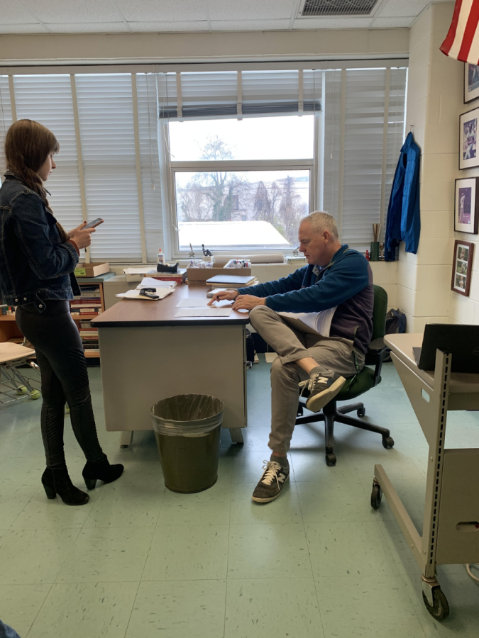 During lunch, AP Human Geography and AP World teacher Chris Merrill helps students get work done and answers questions in room 117. He is almost always willing and available at lunch with a quick heads up.