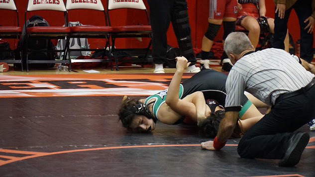 Junior Emma Matalia pins a wrestler from Montgomery Blair. The dual meet took place Wednesday, Jan. 18, with Matalia winning her match up.