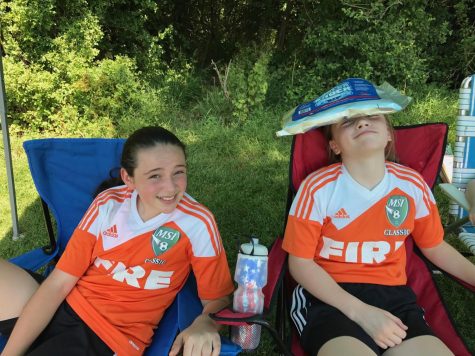 (From left) Lexie Conaway and Katie Martin rest in between soccer games in 4th grade. The two have been participating in sports and social events since before they could remember.