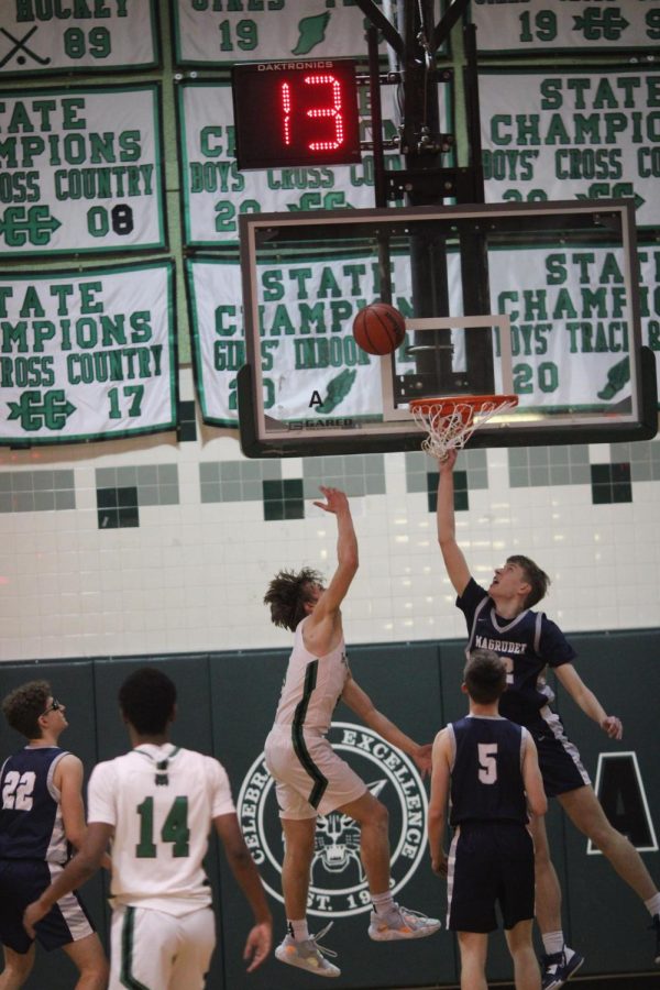 Senior Dawson Carr lays the ball over Magruders post player. This winning streak has given the team more confidence for the rest of the season.