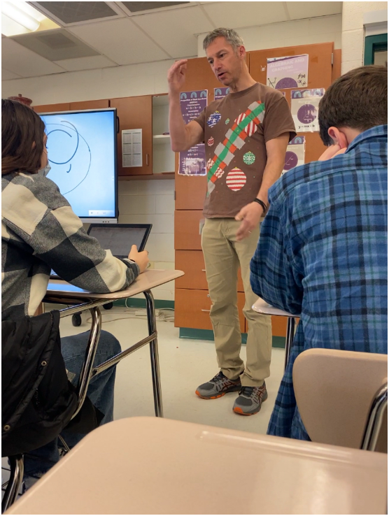 Math teacher Steven Kerr responds to a question from his students. The class was reviewing for a quiz and Kerr was taking the time to clear up any confusion.