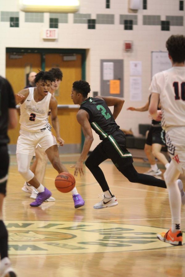 Junior Namori Omog brings up the ball, looking for an opportunity. This was the second time the Wildcats competed against the Patriots.