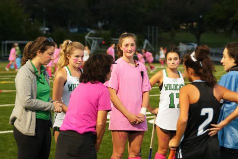 Head field hockey coach Laura Brager (left) meets with the referees, captains and the other team ahead of the Wildcats senior night victory over the Sherwood Warriors. Brager led the Wildcats to a 7-4-1 record this past fall.