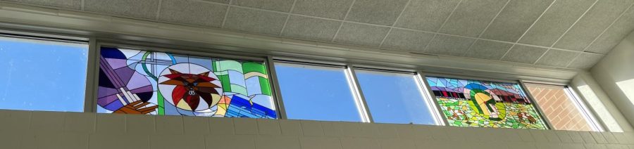 Across from the weight room, above the exit, sits a beautiful mosaic of the two WJ mascots of the past and present.