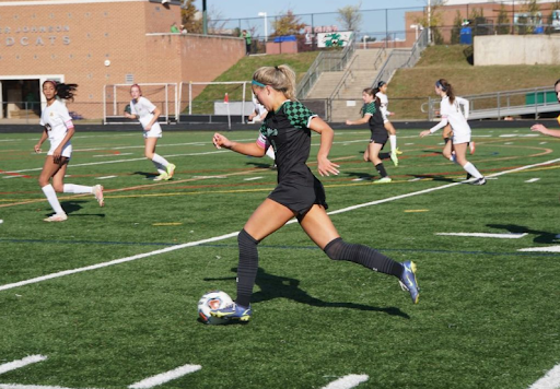 Senior captain Vivian Vendt dribbles through the midfield at a game against Richard Montgomery. The Wildcats defeated the Rockets 4-1.