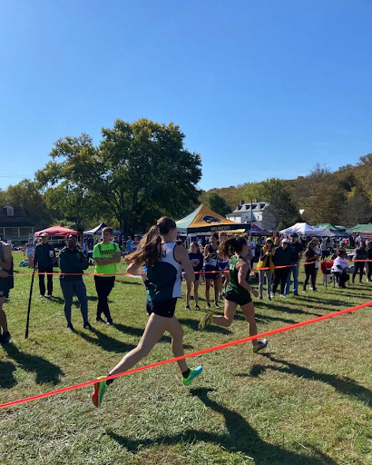 Junior Elizabeth Fogg runs a 5K behind Elizabeth Finn in the Gunpowder Falls Invitational; during the cross-country season.  Running long distances is preferred by Fogg because she enjoys pushing her body to the limits.  “Runners’ high is real, and I feel it most when I run long distances,” Fogg said.