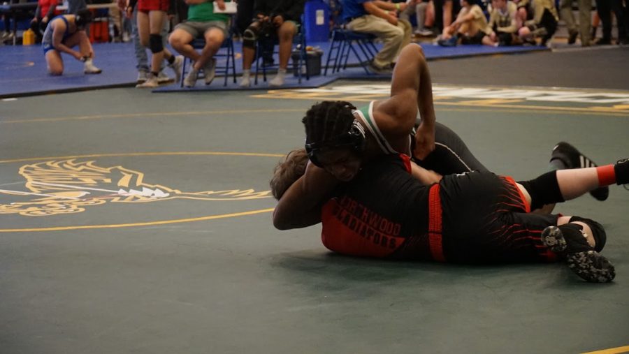 Sophomore Zachary Wray pins a wrestler from Northwood. He went on to win this match before falling in the second round.
