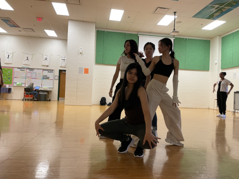 From left: senior Tatiana Vasquez, senior Rachel Bahn, senior Allison Lee  and sophomore Alexis Anne Batac practice their routine for International week at practice after school on Thursday, Feb. 16. They held practices biweekly to prepare.
