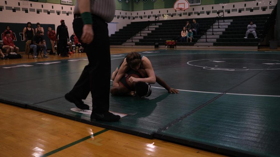 Sophomore Hudson Barrett pins a wrestler from Northwood. Barrett won his matchup and was one of the key contributors to the massive victory.