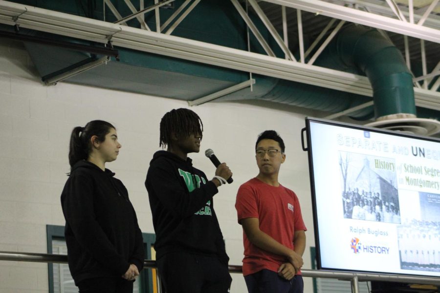 From left: History Club vice president Defne Ustundag, BSU president Jalen Scott and History Club president Seyun Park welcome students and the guest speaker.