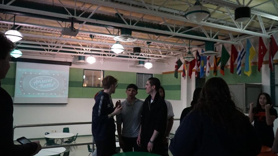 Family Feud participants face off for a trivia question. The event was hosted after school Tuesday Feb. 21 and attracted students looking to play a fun game and contribute to a good cause. 