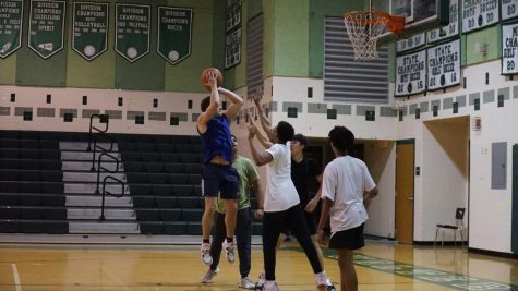 Senior Kevin Murphy goes in for a jump shot during the Pennies for Patients 3v3 tournament on Feb. 16. The tournament was a big hit and raised money for the P4P fundraiser. 