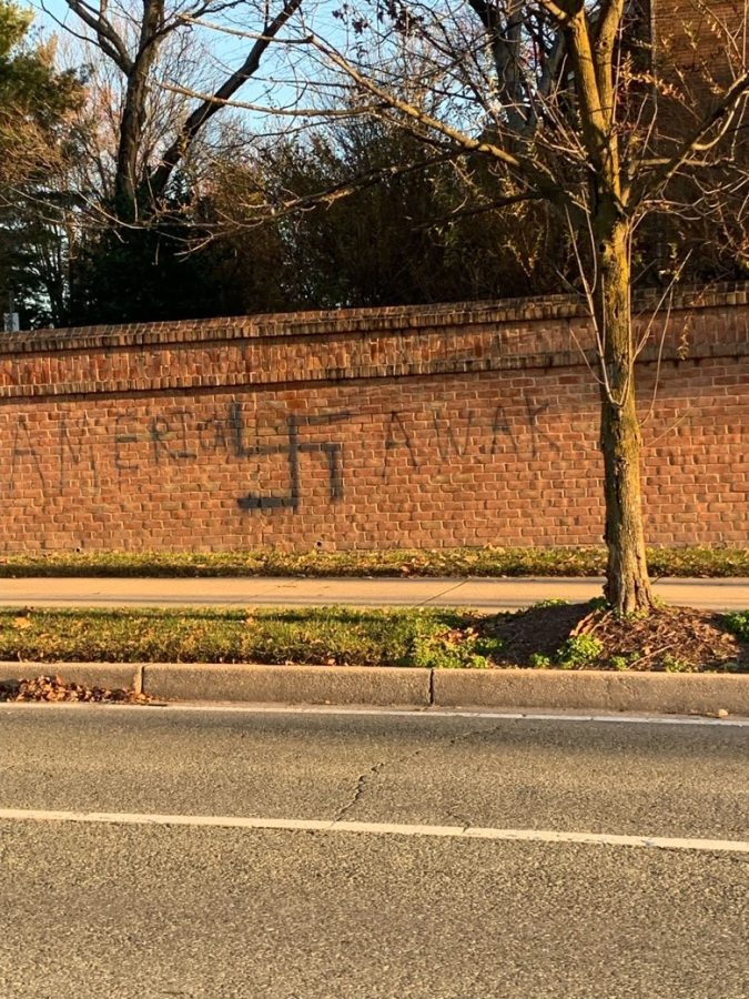 A swastika and America Awake on a brick wall on Tuckerman Lane in early November.
