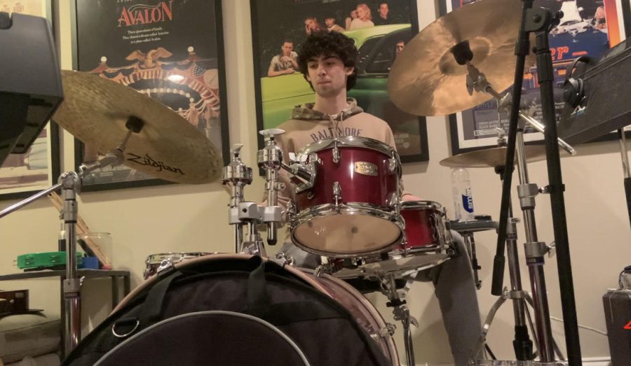 Junior Bradley West drums in his home basement studio. 