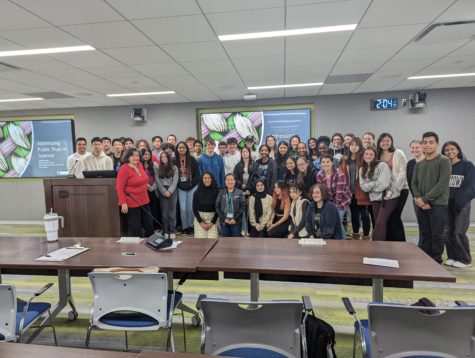 AP Biology students pose with their teacher Khanh Chau and the in-person panelists Judith Arroyo, PhD, NIH and Lunet Luna, PhD, NIH and the discussion on public trust in science concludes.