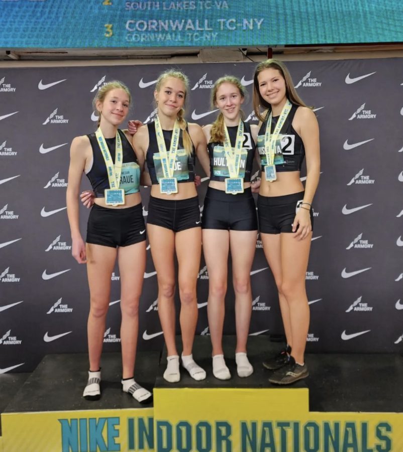 %28From+left%29+Megan+Raue%2C+Mackenzie+Raue%2C+Carolyn+Hultman%2C+and+Zuzana+Huserova+strike+a+pose+stop+the+podium+at+the+2023+Nike+Indoor+Nationals.+The+girls+not+only+finished+top+five%2C+but+set+a+new+personal+and+school+record+in+the+4x800+and+were+also+dubbed%2C+All-Americans.