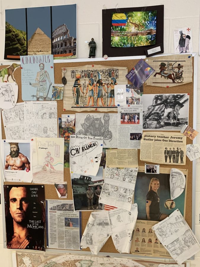 A+bulletin+board+in+Jeremy+Butlers+room+is+covered+with+drawings+and+printed+creations+made+by+students.+My+favorite+project+is+the+one+I+do+each+semester+in+both+Ancient+Mediterranean+and+Medieval+History%2C+I+pick+a+topic+and+have+students+draw+cartoons.+This+past+semester+in+Ancient+Mediterranean+Civilizations%2C+I+picked+the+Odyssey+%5Bto+inspire+their+cartoons%5D.+They%E2%80%99re+encouraged+to+be+a+little+humorous%3B+they+don%E2%80%99t+have+to+stick+to+the+time+period+or+script+exactly+as+long+as+they+know+the+stops.+It%E2%80%99s+fun+because+if+their+art+is+bad%2C+it%E2%80%99s+entertaining+%5Band%5D+sometimes+it%E2%80%99s+so+bad%2C+it%E2%80%99s+good.+Other+times+it%E2%80%99s+so+good%2C+you+hang+%5Bthem%5D+up+%5Band%5D+use+them+as+decorations+for+your+class%2C+Butler+said.