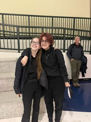 Seniors Frankie Grimaldi and Emily Paranzino pose in their Homecoming attire. Grimaldi wore a dress to prom last year, but plans to wear a suit to this years formal.