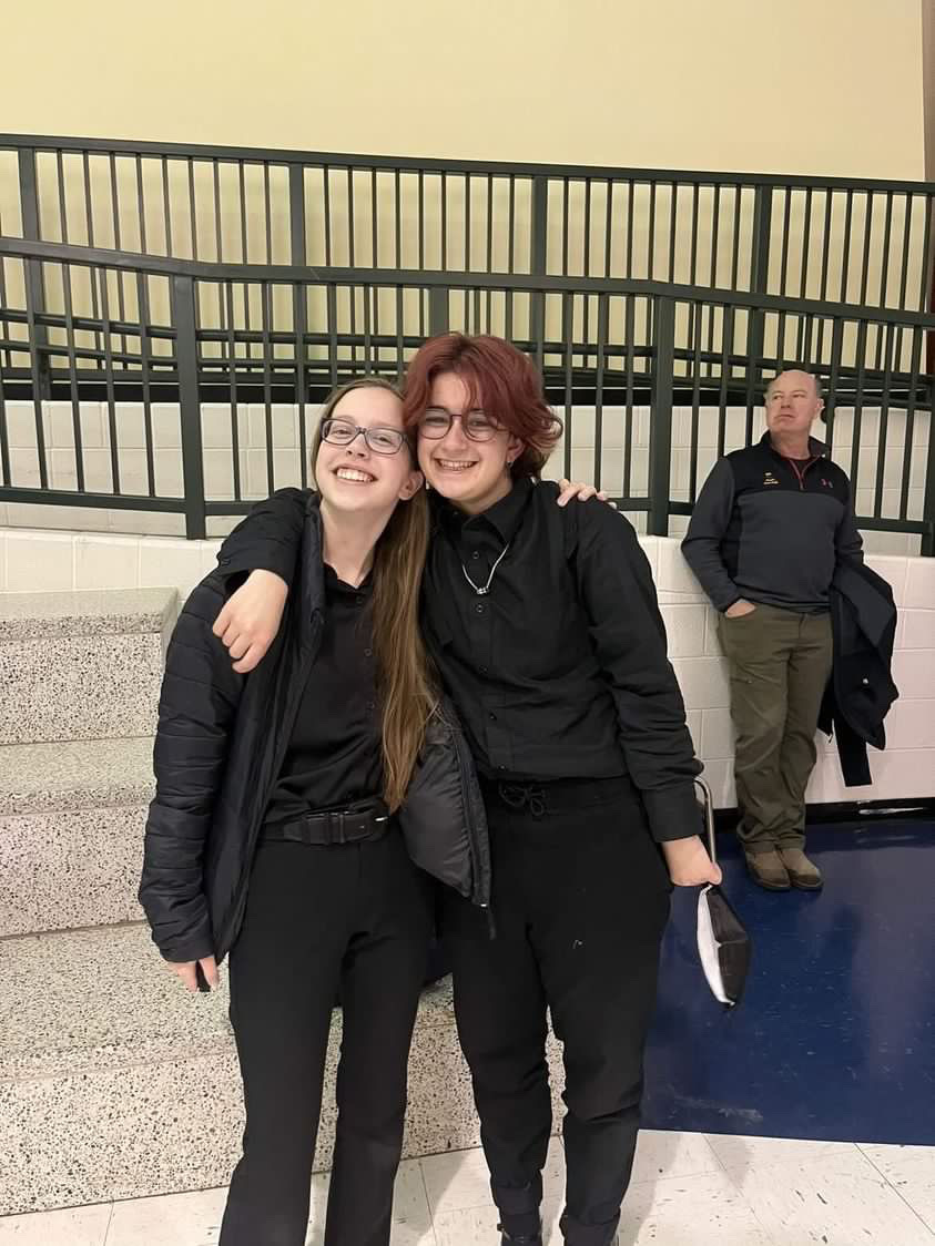 Seniors Frankie Grimaldi and Emily Paranzino pose in their Homecoming attire. Grimaldi wore a dress to prom last year, but plans to wear a suit to this years formal.