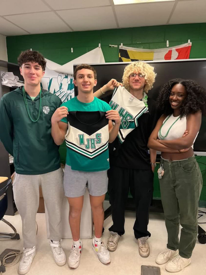 Senior class SGA Ava Benson, Andrew Plotnick, Tomas Flores and Leo Pahuja take a picture together rocking WJ spirit during the week of the pep rally. It was a busy time and we made many decorations to set up. I enjoyed making the senior banner and painting other decorations, Benson said.
