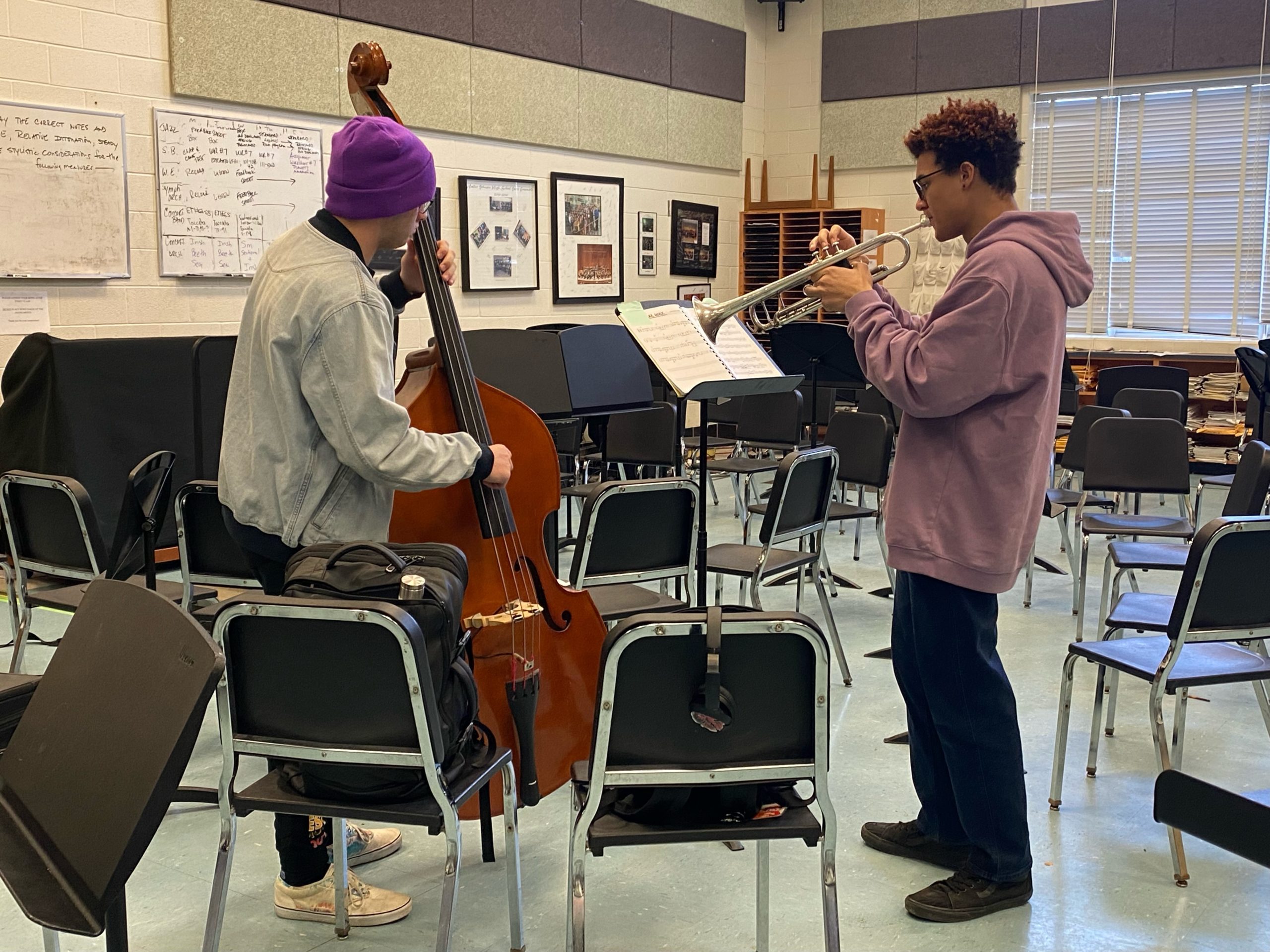 Seniors John Grossman (left) and Sebastian Lee (right) play their instruments during lunch. Theyre very dedicated to WJ music and are hoping to pursue music in college.