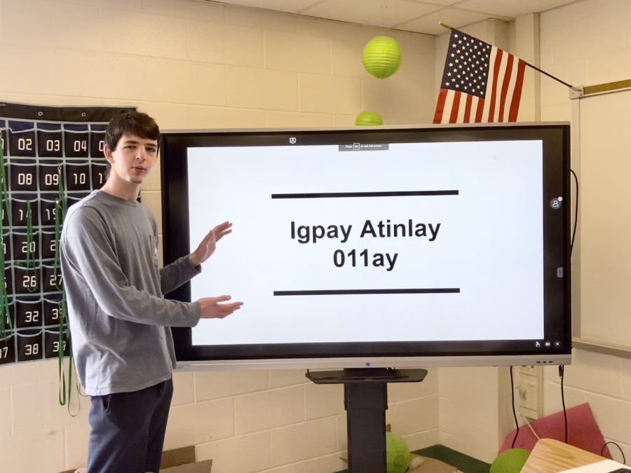 Society president Alexander Lewton gives a presentation about the basics of Pig Latin. The presentation was a precursor to the societys first official meeting on Friday in the stadium.
