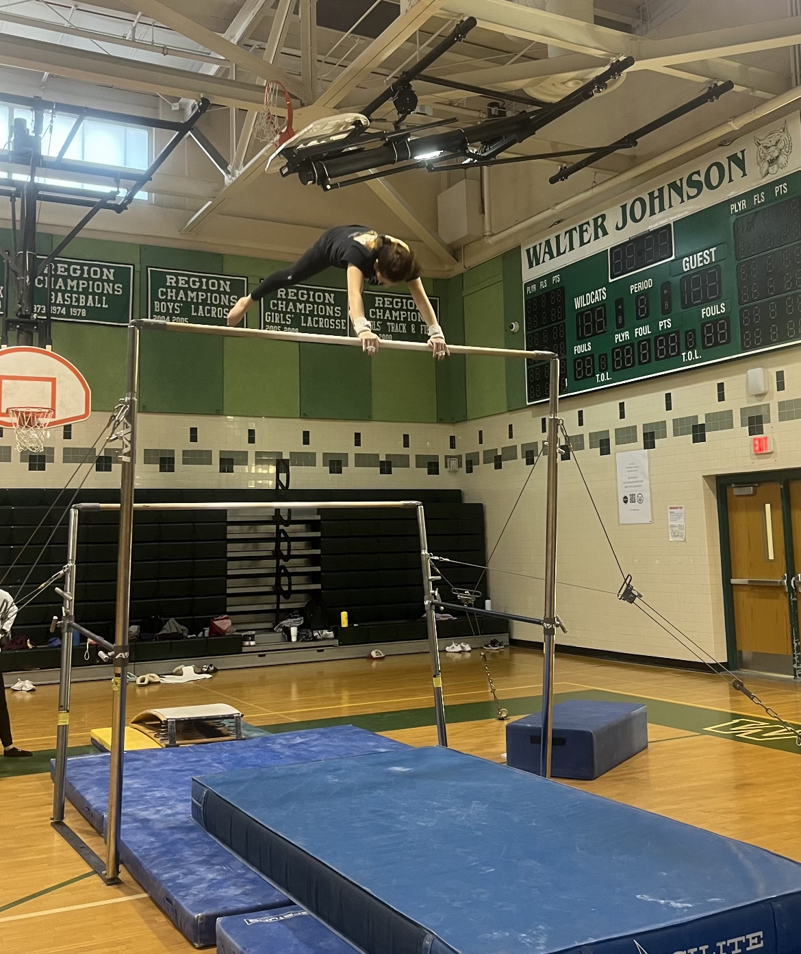 Senior Enia Dagnese practices her bar routine. The WJ gymnastics team has been preparing for their competition season.