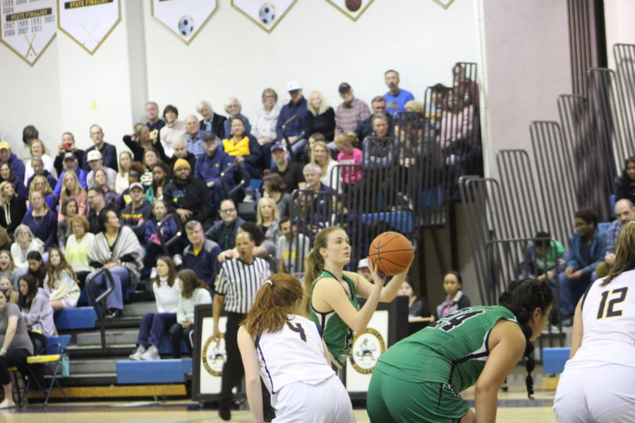 Junior guard Kate Kreisle attempts a free throw in the second half of the Wildcats first round playoff game against BCC. The Wildcats were defeated by the Barons 51-18 ending their 2023 championship aspirations.