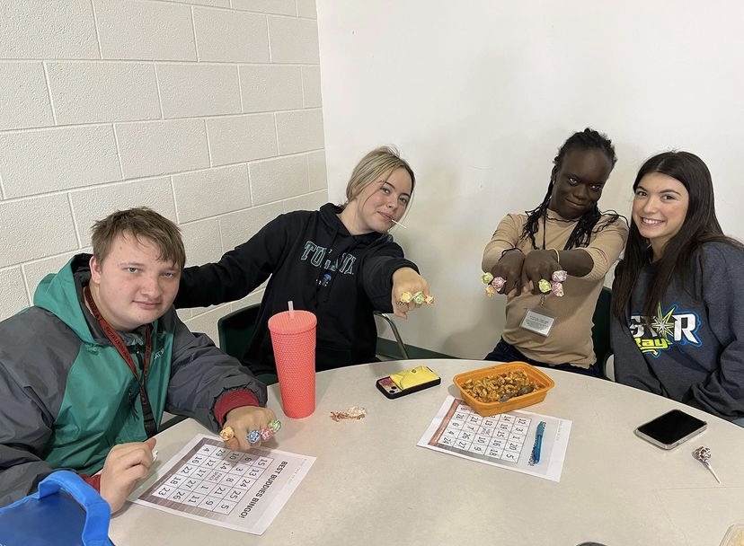 Best Buddies holds a Bingo event in the student commons. The club leadership organized this event, something that is a common task of leadership.