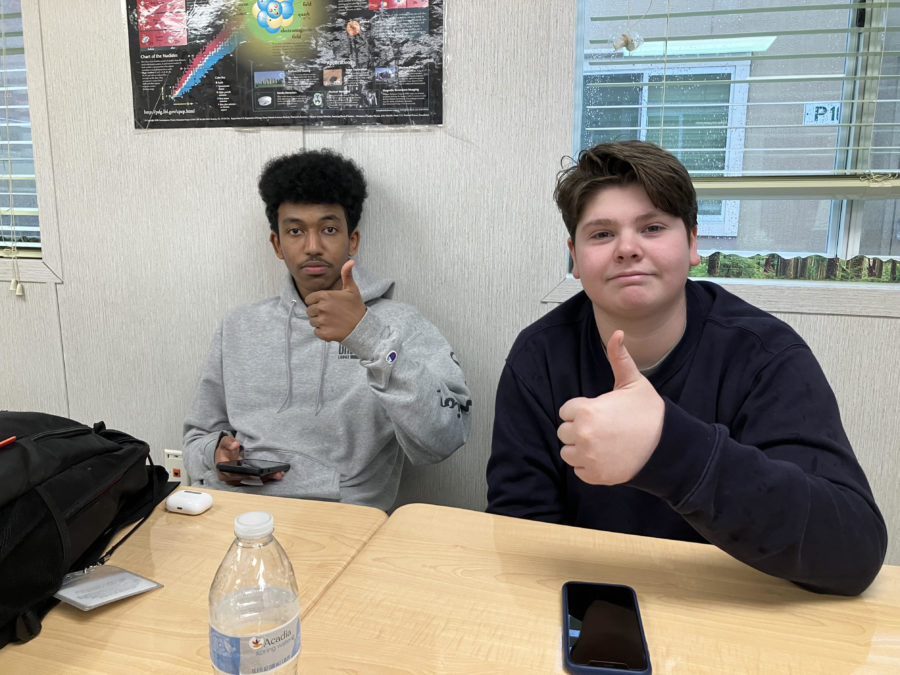 Seniors Nathaniel Bennett and Jack Kennon tune out and relax  after completing their classwork.