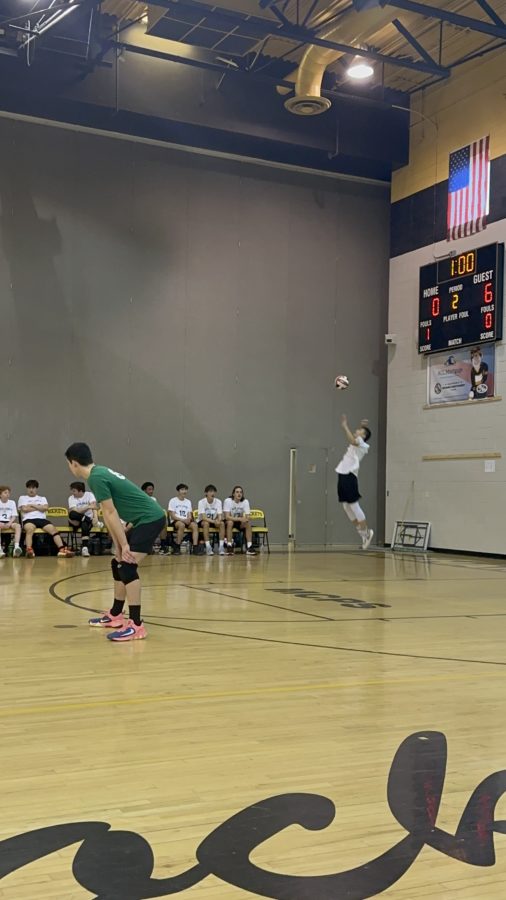 Senior outside hitter Jagger Yung serves the ball in the match against Richard Montgomery. The team went on to win 3-1, starting their season off on the right track.