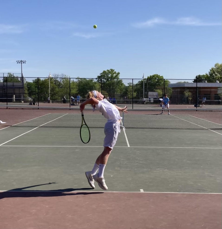Sophomore singles player Brady MacBride serves in a match against the Whitman Vikings. The boys tennis team looks to end their losing skid against the defending 2A State Champion Poolesville Falcons on Tuesday, April 25.