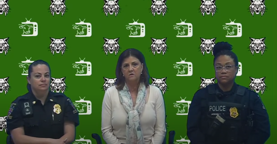 Montgomery County Police Department 2nd District Commander Amy Daum, Principal Jennifer Baker and Community Engagement Officer Shate Jackson address the school during the morning announcements informing them of the changes to the open lunch policy. The new policy will require students to return to campus after purchasing food and drink.