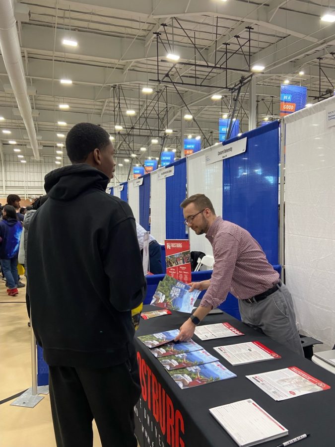 A student speaks with a representative from Frostburg State University. Long lines and large crowds plagued students attempting to learn about bigger and more popular schools such as UMD and Penn State.