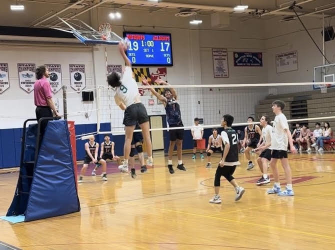 Senior captain Seba Sani spikes the ball against Wootton. The team has looked strong throughout the season with the lone loss so far coming against one seed Churchill.