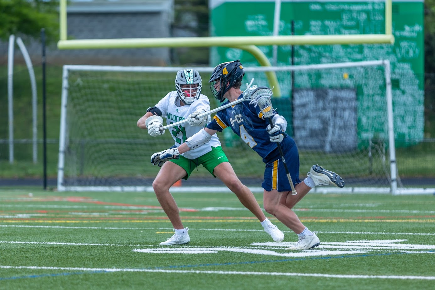 Senior captain and defender Patrick Adams tries to take the ball away from BCCs JP Housman in the Wildcats 7-6 regular season win over the Barons. The Wildcats defeated the Barons again on Wednesday, May 10, this time in the playoffs to advance and face the Churchill Bulldogs.