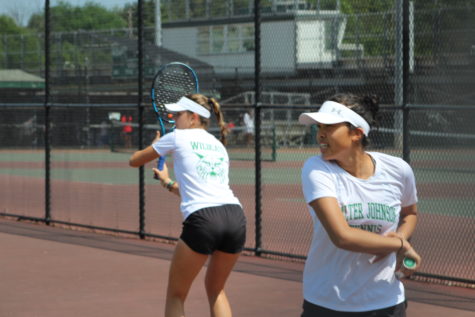 Alicia Barnett and Mia Milicevic practice together during regionals. Each won singles championships during the county tournament.