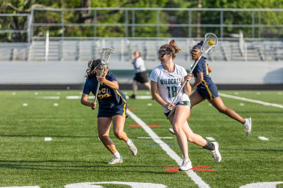 Senior captain and midfielder Olivia McCloskey runs down the field against BCC. McCloskey and the Wildcats came back after being down 5-4 at half, to defeat the Barons 8-7. 