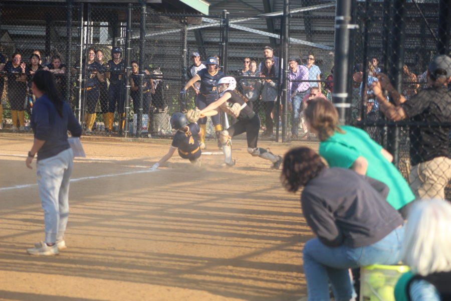 Freshman catcher Alina Bonior tags out a BCC runner at home. The team won the regional championship defeating BCC 13-10 on Wed, May 17.