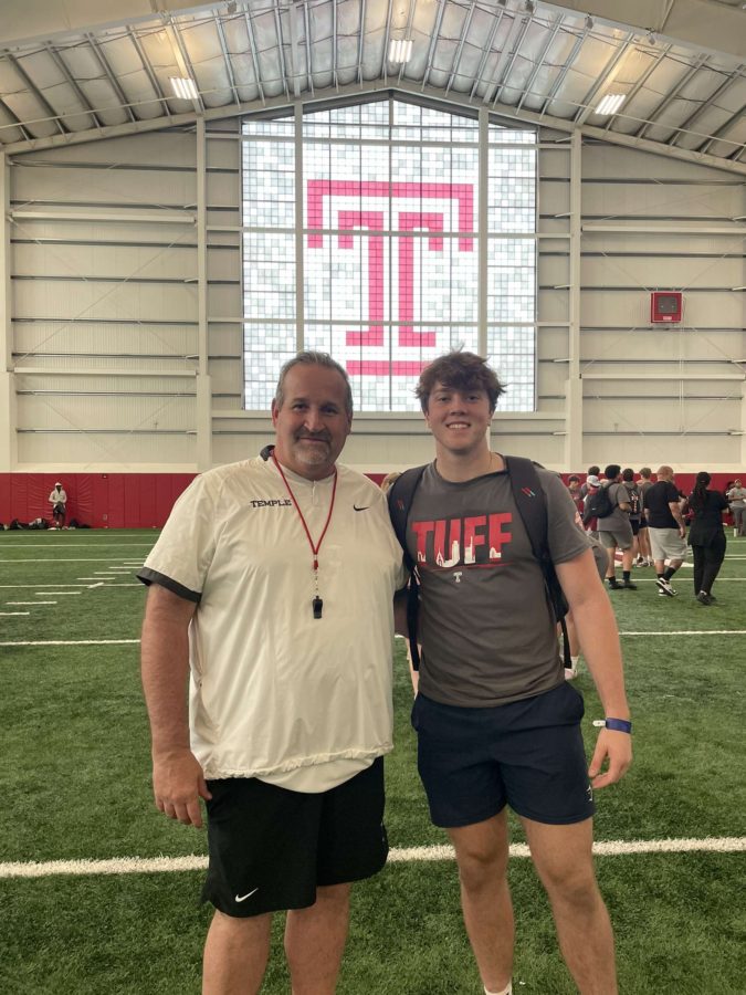 Junior Dylan Minnick smiles with Temples inside linebacker coach Chris Woods. After an intense college camp, the players can meet and make connections with the coaching staff.