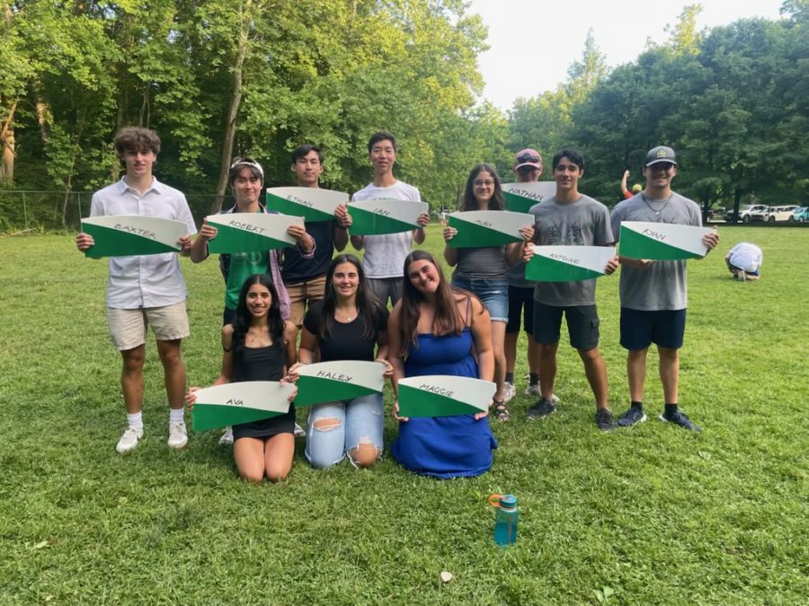 WJ+Crew+club+celebrates+the+end+of+their+year+with+an+End+of+The+Year+Picnic+at+Cabin+John+Regional+Park.+The+graduating+seniors+are+both+sad+for+leaving+the+underclassmen+but+also+excited+for+their+futures+beyond+highschool.+The+seniors+%28top+row+Baxter+Roberts%2C+Robert+Hsu%2C+Ethan+Nguyen%2C+Ian+Shin%2C+Alex+Isaac%2C+Nate+Henderson%2C+Antoine+Fradet%2C+Ryan+Frank%2C+%28bottom+row%29%2C+Ava+Rohatgi%2C+Haley+Minnick%2C+and+Maggie+Berrett+all+lined+up+the+spoon+of+a+WJ+oar+as+their+final+gift.+Im+going+to+miss+all+my+senior+and+underclassmen+friends.+I+really+wish+for+the+younger+atheletes+to+spend+their+times+in+WJ+Crew+with+no+regrets%2C+Berrett+said.
